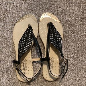 Black and gold sandals
